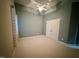 Spacious bedroom with neutral walls, a ceiling fan, and a double door closet at 1113 Bexley Hills Bend Bnd, Apex, NC 27502
