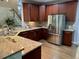 Updated kitchen featuring granite countertops, stainless steel appliances, and wood cabinetry at 1113 Bexley Hills Bend Bnd, Apex, NC 27502