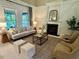 Spacious living room with fireplace, comfortable seating, and ample natural light at 1113 Bexley Hills Bend Bnd, Apex, NC 27502