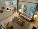 An aerial view of a living room with a ceiling fan and large windows at 1113 Bexley Hills Bend Bnd, Apex, NC 27502