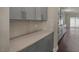 Modern kitchen with gray cabinetry, quartz countertops, and stainless steel appliances at 1113 Dartford Green Pl, Wake Forest, NC 27587