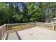 Spacious wooden back deck perfect for outdoor entertaining overlooking a lush, green wooded area at 114 Council Gap Ct, Cary, NC 27513