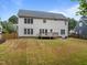 Spacious backyard featuring a well-maintained lawn, wooden fence and deck at 114 Council Gap Ct, Cary, NC 27513