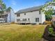 Expansive backyard featuring a well-maintained lawn, wooden fence and deck at 114 Council Gap Ct, Cary, NC 27513