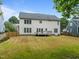 Spacious backyard featuring a well-maintained lawn, wooden fence and deck at 114 Council Gap Ct, Cary, NC 27513