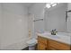 Bright bathroom features a shower-tub combo, sleek vanity, and modern fixtures at 114 Council Gap Ct, Cary, NC 27513