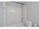 Standard white shower and toilet with shower curtain, towel bar, and toilet paper holder at 114 Council Gap Ct, Cary, NC 27513