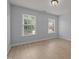 Bedroom with hardwood floors and two large, bright windows at 114 Council Gap Ct, Cary, NC 27513