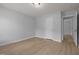 Bedroom featuring light-colored hardwood floors, light walls and white trim at 114 Council Gap Ct, Cary, NC 27513
