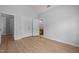 A bedroom with plenty of space, vinyl plank floors, neutral walls, and an ensuite bath at 114 Council Gap Ct, Cary, NC 27513