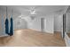 A bonus room with lots of natural light, luxury vinyl plank flooring, and ceiling fans at 114 Council Gap Ct, Cary, NC 27513
