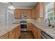 Well-equipped kitchen features stainless steel appliances and beautiful granite countertops at 114 Council Gap Ct, Cary, NC 27513
