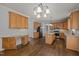 Spacious kitchen with stainless steel appliances, custom cabinets, and eat-in island at 114 Council Gap Ct, Cary, NC 27513