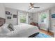 Cozy bedroom features hardwood floors, natural lighting, and neutral wall colors at 1209 Edgevale Rd, Durham, NC 27701