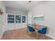 Dining room with wood table and blue chairs with built-in shelves and decor at 1209 Edgevale Rd, Durham, NC 27701