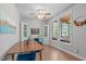 Dining room with beautiful wood table and chairs, hardwood floors, and natural light at 1209 Edgevale Rd, Durham, NC 27701
