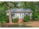 Charming single-story home with light siding, brick foundation and well-maintained landscaping at 1209 Edgevale Rd, Durham, NC 27701