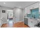 Kitchen with stainless steel appliances, modern backsplash, and easy access to living room at 1209 Edgevale Rd, Durham, NC 27701