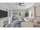 Inviting living room featuring hardwood floors, contemporary furniture, and bright, natural light at 1209 Edgevale Rd, Durham, NC 27701