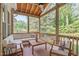 Outdoor screened porch with seating area, ceiling fan, and view of the pool at 1209 Edgevale Rd, Durham, NC 27701