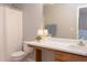 Cozy bathroom with white shower curtain, extended vanity, and neutral decor, providing a comfortable space at 12320 Tetons Ct, Durham, NC 27703