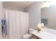 Bathroom featuring shower with white curtain and a vanity with a lamp and decorative items at 12320 Tetons Ct, Durham, NC 27703