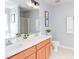 Bathroom with double sink vanity, shower and toilet; neutrally decorated at 12320 Tetons Ct, Durham, NC 27703