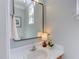 Clean bathroom with white sink and counter, mirror, and natural light, offering a fresh feel at 12320 Tetons Ct, Durham, NC 27703