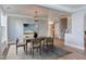 This dining room features a decorative light fixture and a view to the stairs at 12320 Tetons Ct, Durham, NC 27703