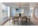 This dining room features a decorative light fixture and view of the rear yard at 12320 Tetons Ct, Durham, NC 27703