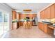 Spacious kitchen with wood cabinets, stainless steel appliances, and a center island at 12320 Tetons Ct, Durham, NC 27703