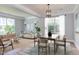 Inviting living room featuring modern decor, wood floors, and ample natural light at 12320 Tetons Ct, Durham, NC 27703