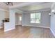 Bright living room features wood floors, gray walls, white trim and lots of natural light at 12320 Tetons Ct, Durham, NC 27703