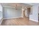 This living room has wood floors, light gray walls, white trim and a view to the stairs at 12320 Tetons Ct, Durham, NC 27703