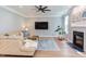 Inviting living room with fireplace, television, and comfortable sectional sofa at 12320 Tetons Ct, Durham, NC 27703