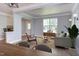 Open-concept living space with new floors and modern décor; airy and bright at 12320 Tetons Ct, Durham, NC 27703