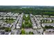Scenic aerial view of a neighborhood street lined with beautiful homes and lush trees at 1304 Rodessa Run, Raleigh, NC 27607