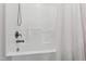 Bright bathroom features a white tub with shower and modern fixtures at 1304 Rodessa Run, Raleigh, NC 27607