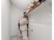 Walk-in closet with ample storage and clothing rack system at 1304 Rodessa Run, Raleigh, NC 27607