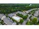 Aerial shot presents a community pool, clubhouse, and charming townhomes at 1304 Rodessa Run, Raleigh, NC 27607