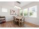 Light-filled dining room showcasing modern chandelier, neutral decor, and views to the outside at 1304 Rodessa Run, Raleigh, NC 27607