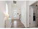 Bright foyer with wood floors and access to laundry at 1304 Rodessa Run, Raleigh, NC 27607
