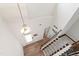 Bright entryway with soaring ceilings shows beautiful wood floors and carpeted stairs at 1304 Rodessa Run, Raleigh, NC 27607