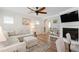 Cozy living room featuring a fireplace and seamless transition to the open kitchen area at 1304 Rodessa Run, Raleigh, NC 27607