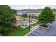 Aerial view of the community playground, surrounded by picnic shelter, and colorful townhomes at 1304 Rodessa Run, Raleigh, NC 27607