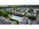 Aerial view showcases community pool, surrounded by townhomes and lush green trees at 1304 Rodessa Run, Raleigh, NC 27607