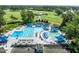 Aerial view of a country club and pool area featuring a golf course at 1304 Sandpiper Ct, Raleigh, NC 27615