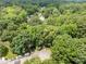 Lush, wooded neighborhood showcasing mature trees and well-maintained homes at 1304 Sandpiper Ct, Raleigh, NC 27615