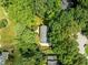 An aerial view of the rooftop of a home nestled in a forest at 1304 Sandpiper Ct, Raleigh, NC 27615