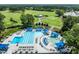 Beautiful aerial view showcasing the sparkling pool and golf course at 1304 Sandpiper Ct, Raleigh, NC 27615